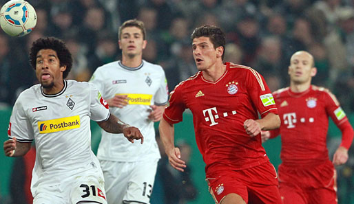 Dante (l.) spielt in der kommenden Saison an der Seite von Mario Gomez und Arjen Robben