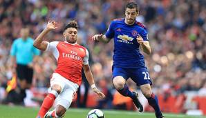 Henrikh Mkhitaryan im Zweikampf gegen Oxlade-Chamberlain