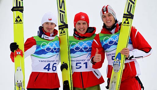 Simon Ammann (m.) gewinnt Gold vor Adam Malysz (l.) und Gregor Schlierenzauer (r.)