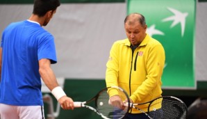 PARIS, FRANCE - JUNE 04: Novak Djokovic of Serbia speaks with coach Marian Vajda during a training session on day fourteen of the 2016 French Open at Roland Garros on June 4, 2016 in Paris, France. (Photo by Dennis Grombkowski/Getty Images)