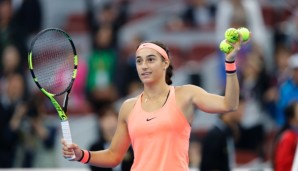 BEIJING, CHINA - OCTOBER 05: Caroline Garcia of France celebrates her win over Peng Shuai of China during the Women's singles second round match on day five of the 2016 China Open at the China National Tennis Centre on October 5, 2016 in Beijing, Ch...